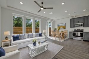 a living room with a white couch and a table