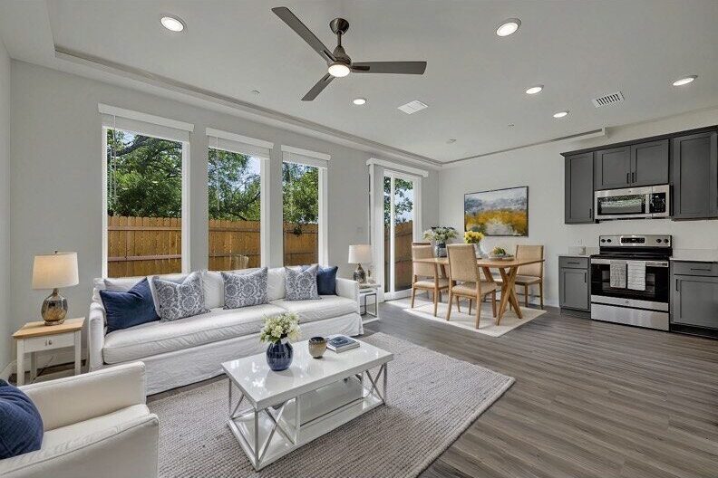 a living room with a white couch and a table
