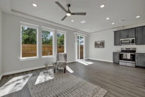 a room with a wood floor and a ceiling fan