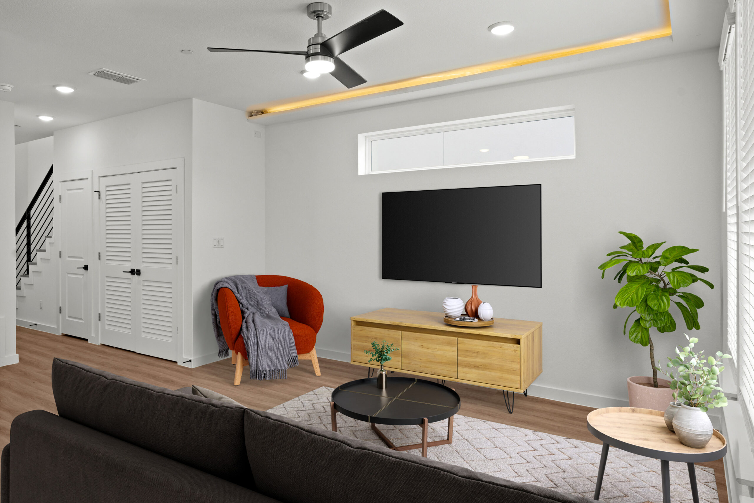 a living room with a tv on the wall