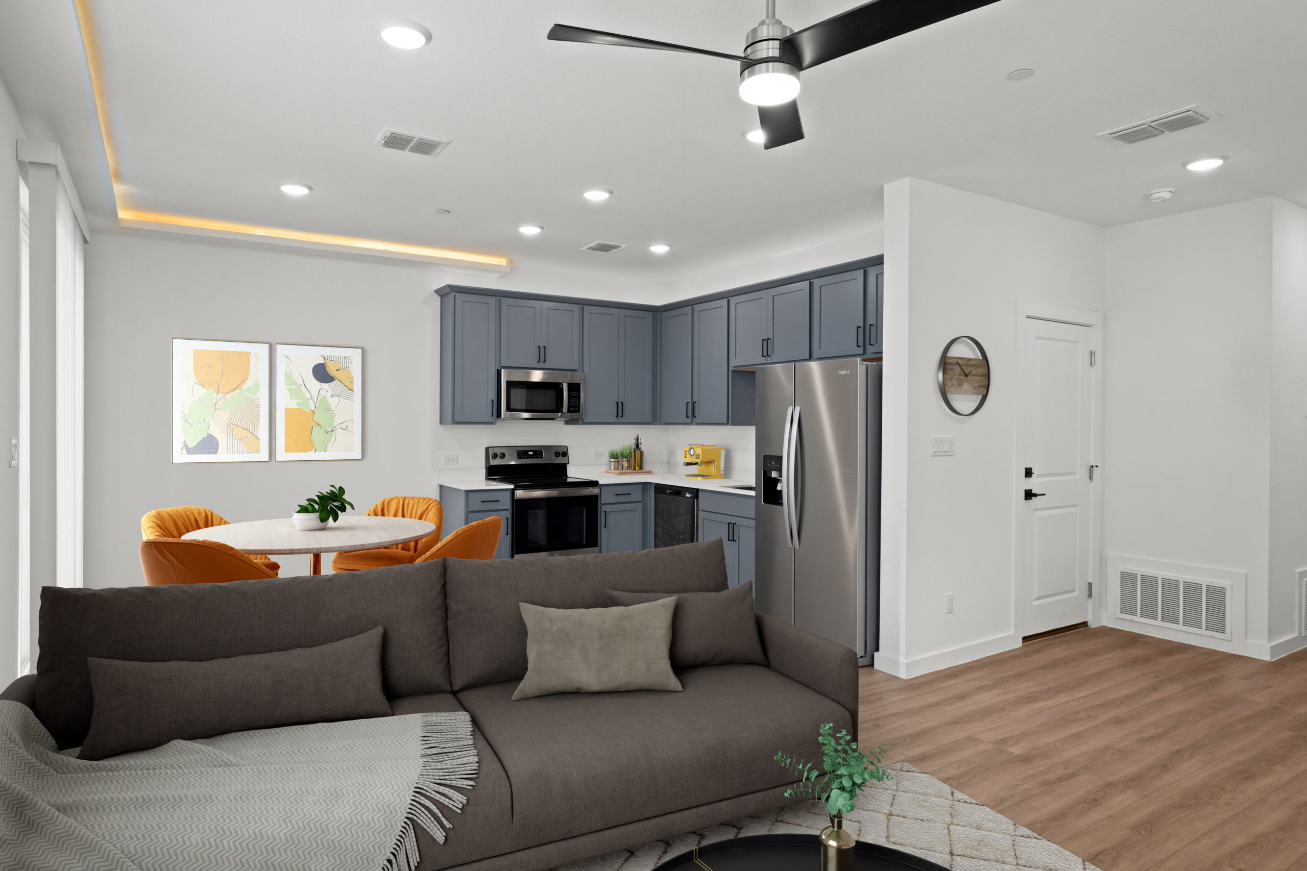 a living room with a couch and kitchen