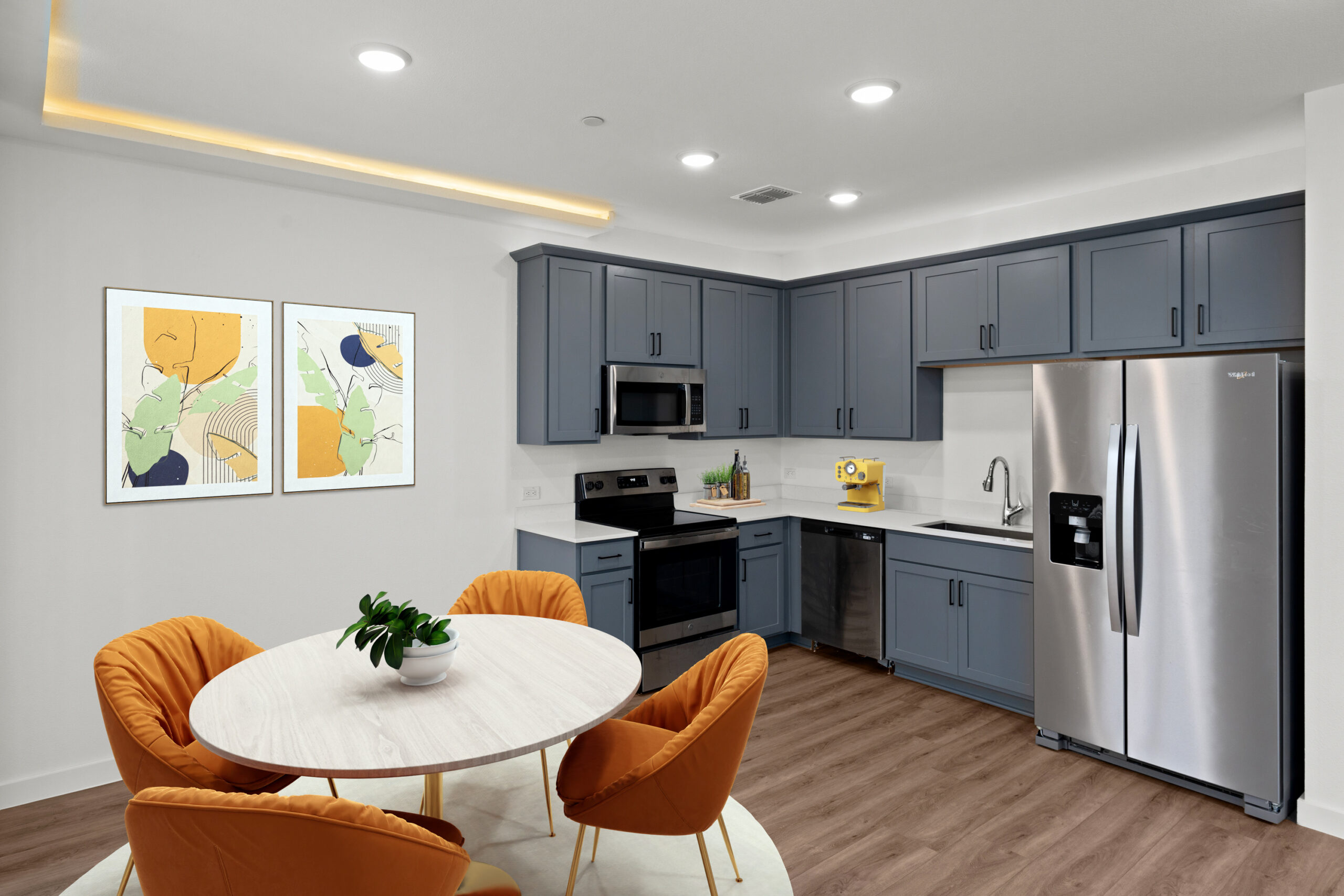 a kitchen with a table and chairs